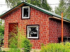 Загородный дом, обшитый металлическим 
сайдингом с покрытием printech Rustic Brick, имитирующим кладку из обожженного кирпича