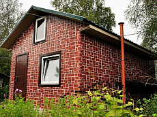 Загородный дом, обшитый металлосайдингом 
с покрытием printech Rustic Brick под жженый кирпич